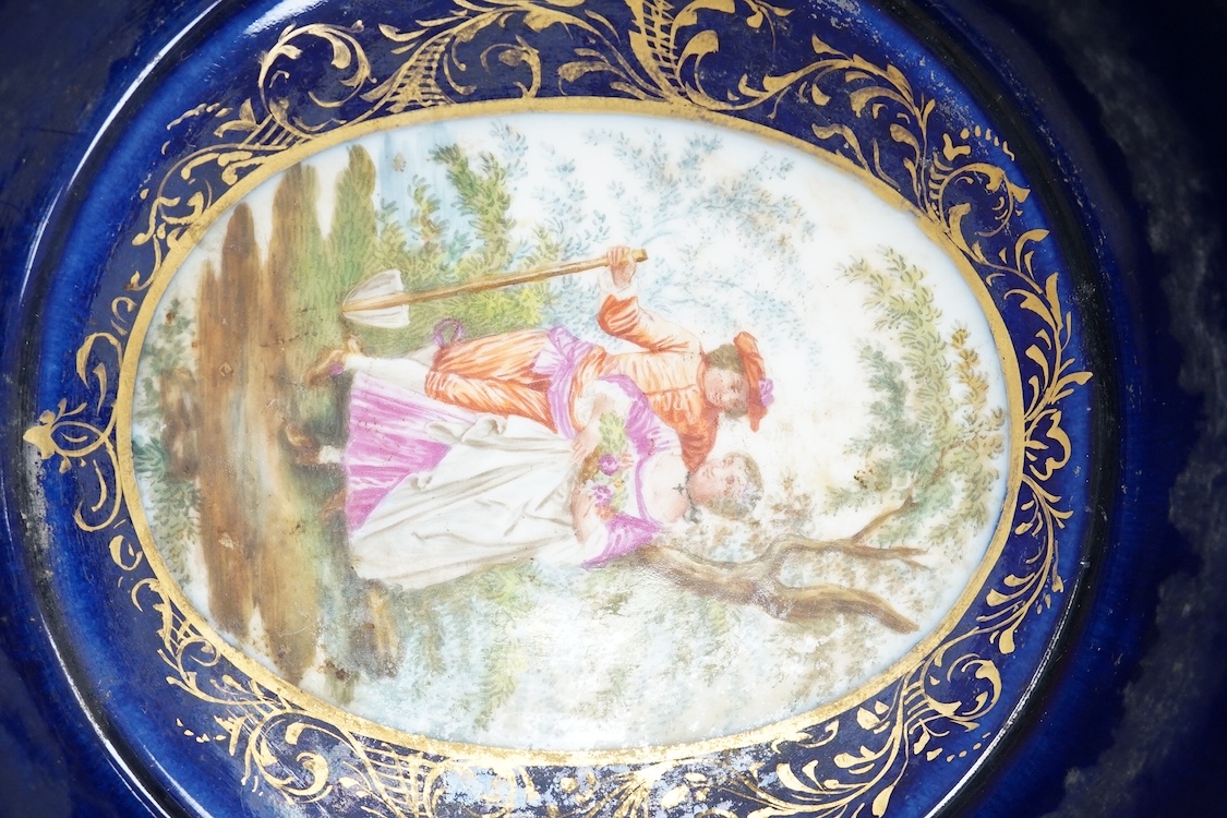 A 19th century Vienna saucer, hand painted with two figures beneath a tree, 15cm in diameter